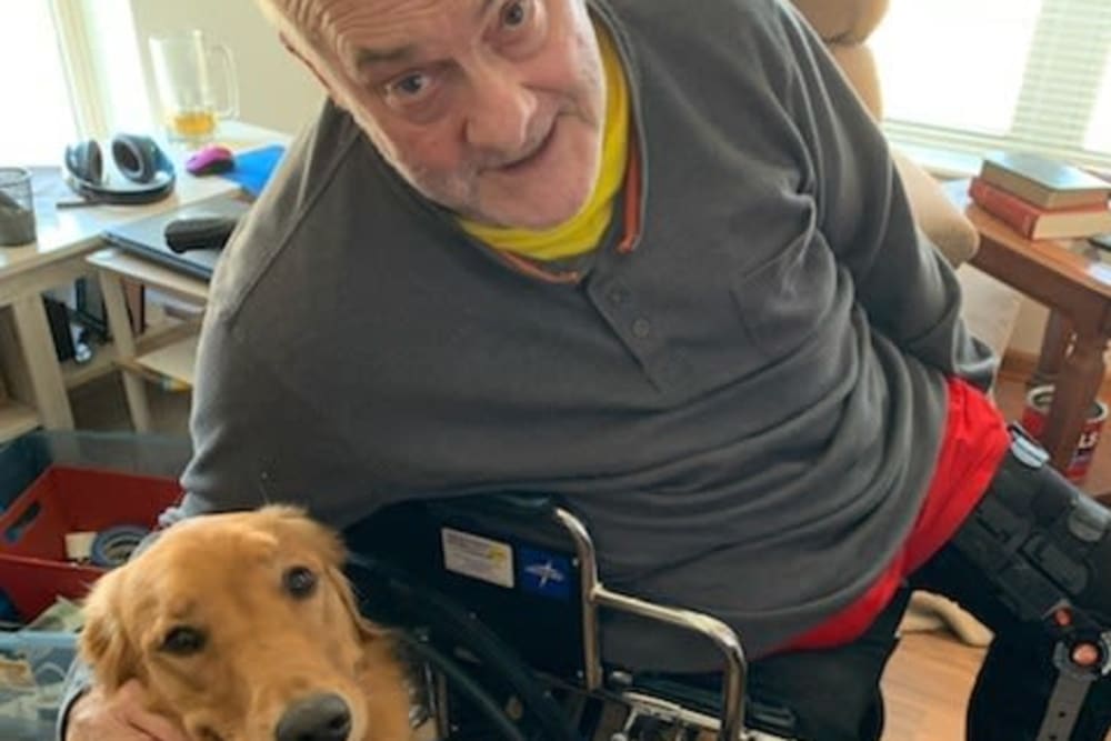 Resident and dog at Age Well Centre for Life Enrichment